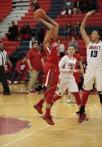 Arbor View’s Janae Strode (32) takes a shot as Liberty’s Aubre’ Fortner (1 ...