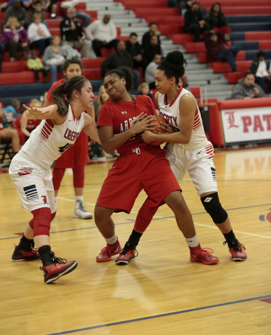 Liberty’s Nancy Caballero (left) and Aubre Fortner (right) battle Arbor View’s K ...