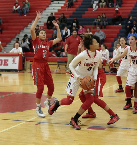 Liberty’s Jaelyn Royal (5) looks for an opening to shoot the ball during the second ha ...