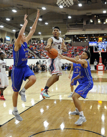 Bishop Gorman center Chase Jeter (4) strips the ball away from Findlay Prep guard Allonzo Tr ...