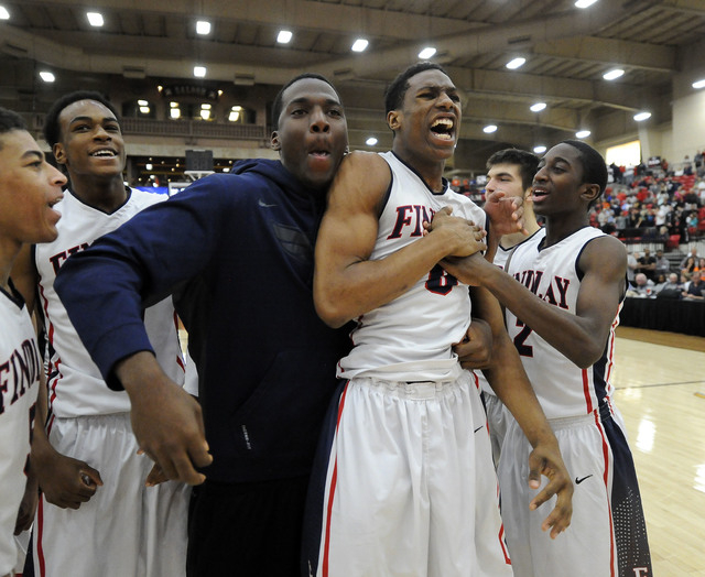 Findlay Prep forward Horace Spencer III (0), forward Khalea Turner, (left), and teammates ce ...