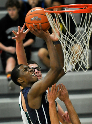 Agassi Prep’s Deishuan Booker shoots against Rancho on Monday. Booker scored 14 of his ...