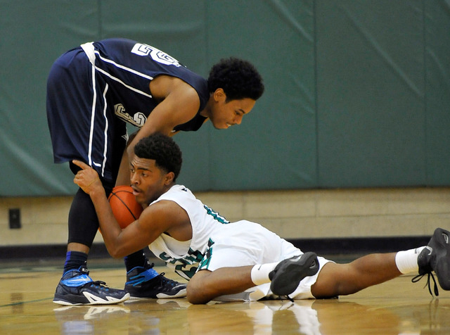 Agassi Prep’s Kenneth Hatano, left and Rancho’s Dion Southern grapple for the ba ...