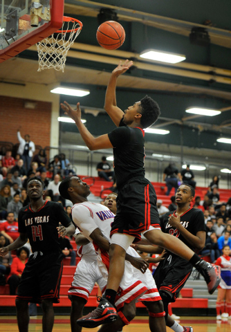 Las Vegas’s Devon Colley shoots against Valley’s Nick Brannon during a high scho ...