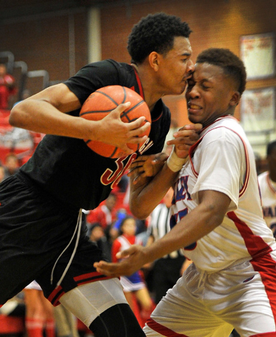 Las Vegas’ Tyler Bey, left, and Valley’s Darrion Daniels bump heads on Tuesday. ...