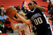Arbor View’s Kelsey Rasore and Centennial’s Tanjanae Wells vie for a rebound on ...