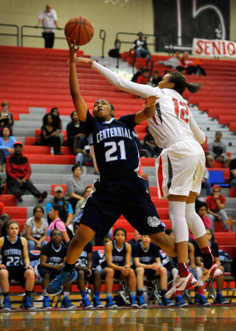 Centennial’s Justice Ethridge shoots against Arbor View’s Ariona Gill on Monday. ...