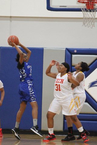 Desert Pines’ Adrianne Jackson (20) looks to pass against Tech in the Lady Wolves Holi ...