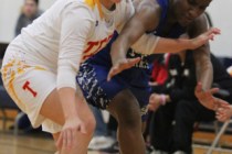 Tech’s Grace Malek, left, and Desert Pines’ Tanauya Hinton (14) fight for posses ...