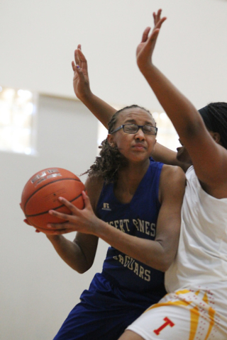 Desert Pines’ Brianna Fitzgerald (24) looks for an opening against Tech’s Patric ...