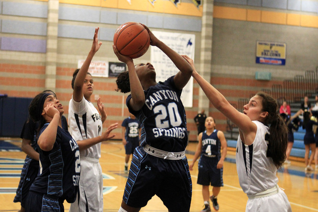 Canyon Springs’ Alexia Thrower is defended by Foothill’s Katey Roquemore on Tues ...