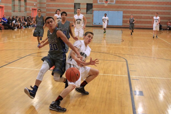 Basic guard Chaz Lucero knocks the ball out of the hands of Palo Verde’s Thomas Reymon ...
