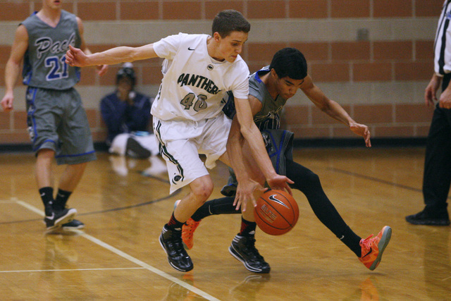 Palo Verde’s Thomas Reymond and Basic forward Justice Augustine chase down a loose bal ...