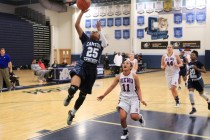 Canyon Springs guard D’Licya Feaster gets past Reno guard Daranda Hinkey for a basket ...