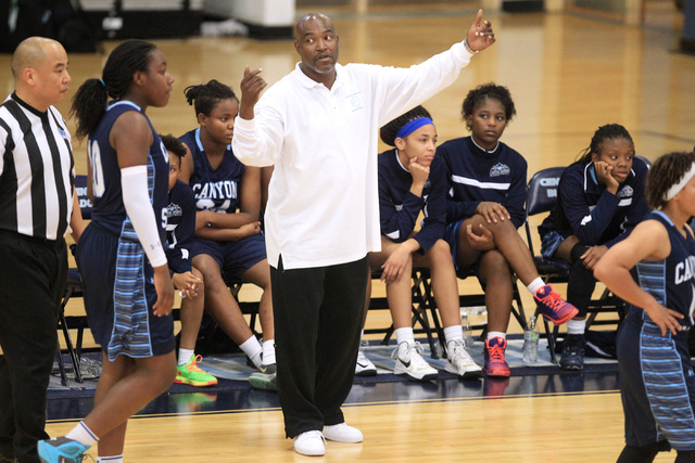 Canyon Springs coach Stan Nelson gathers his players during their Las Vegas Holiday Classic ...