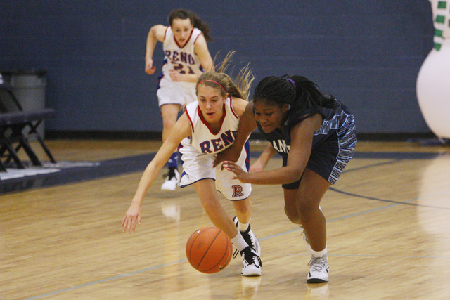 Canyon Springs guard Destini Hunter steals the ball from Reno guard Mikayla Shults during th ...