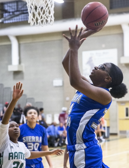 Sierra Vista’s Shania Harper (34) shoots over Rancho’s Alesse Hall (21) during t ...