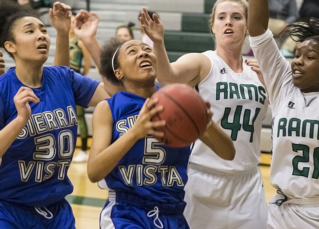Sierra Vista’s Kayla Barnum (5) drives to the basket past Rancho’s Alesse Hall ( ...