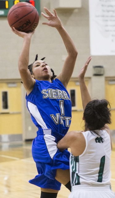 Sierra Vista’s Kayla Smith (1) shoots over Rancho’s Lea Williams (1) during the ...