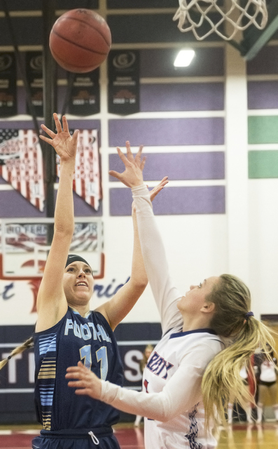 Foothill’s Kylie Vint (11) shoots a jump shot over Liberty’s London Pavlica (5) ...