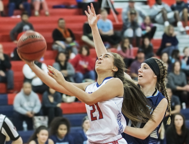 Liberty’s Kaily Kaimikaua (21) slashes to the rim past Foothill’s Kylie Vint (11 ...