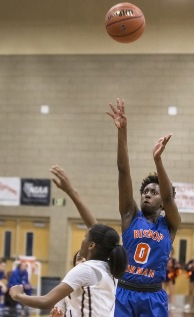 Bishop Gorman’s Quinece Hatcher (0) shoots a three point shot during the Gaels road ma ...