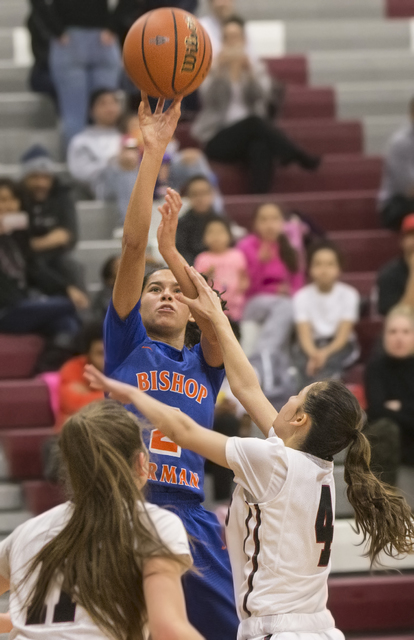 Bishop Gorman’s Shaira Young (2) shoots a three point shot over Desert Oasis’ (4 ...