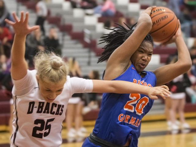 Bishop Gorman’s Skylar Jackson (20) grabs a rebound over Desert Oasis’ Melissa S ...