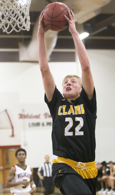 Clark’s Trey Woodbury (22) converts a fast break layup during the Chargers road matchu ...