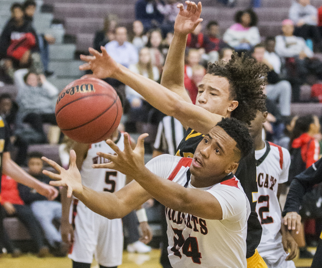 Las Vegas’ Vegas’ Zach Matlock (24) fights for a loose ball with Clark’s I ...