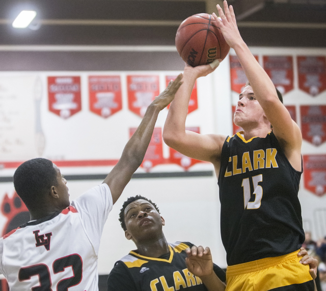 Clark’s James Bridges (15) shoots a jump shot over Las Vegas’ Kiaeem Gonzaque-Jo ...