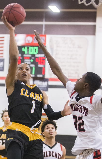 Clark’s Sedrick Hammond (1) shoots over Las Vegas’ Kiaeem Gonzaque-Johnson (32) ...