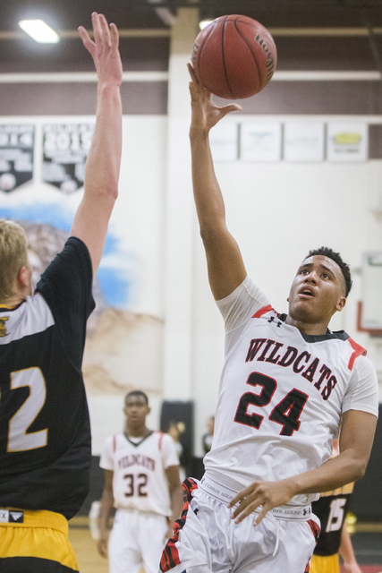 Las Vegas’ Zach Matlock (24) shoots a jump shot over Clark’s Trey Woodbury (22) ...