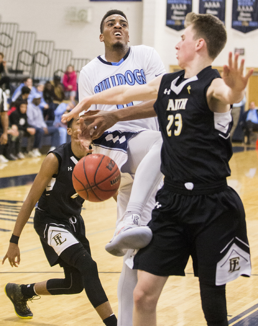 Centennial’s Troy Brown (0) gets fouled on the way to the basket by Faith Lutheran&#82 ...
