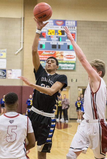 Sierra Vista’s Mathias Aaiva (20) shoot over Desert Oasis’ Manny Mitchell (5) on ...