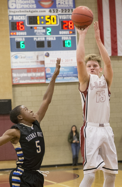 Desert Oasis’ Jacob Heese (15) shoots over Sierra Vista’s Isaiah Veal (5) on Tu ...