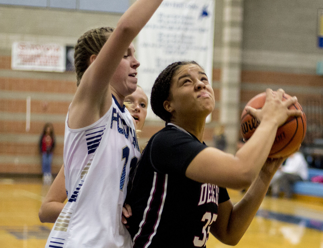 Desert Oasis’ Dajaah Lightfoot, (35), prepares to shoot a basket during a game against ...