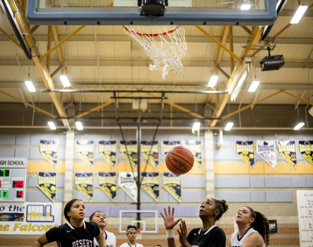 Players from Foothill and Desert Oasis attempt to grab the ball during a game at Foothill Hi ...