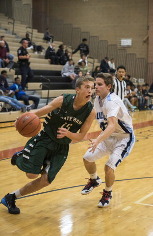 Nate Friesen (15) of Robert Bateman High School of Canada drives the ball past Centennial&#8 ...