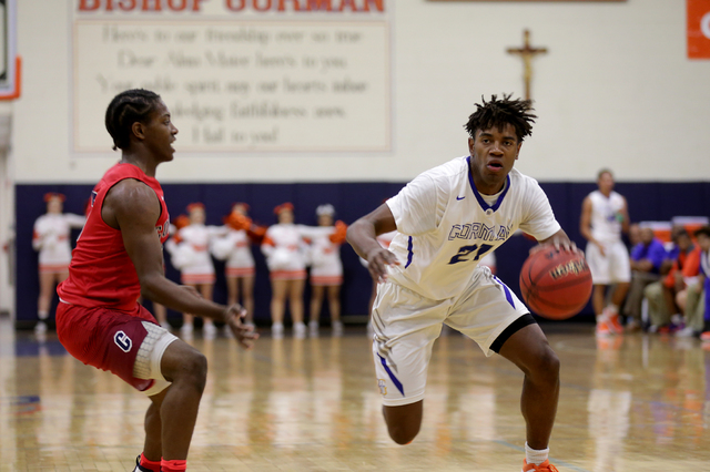 Gorman Bishop’s guard Christian Popoola (21) goes to pass Coronado’s guard Nick ...