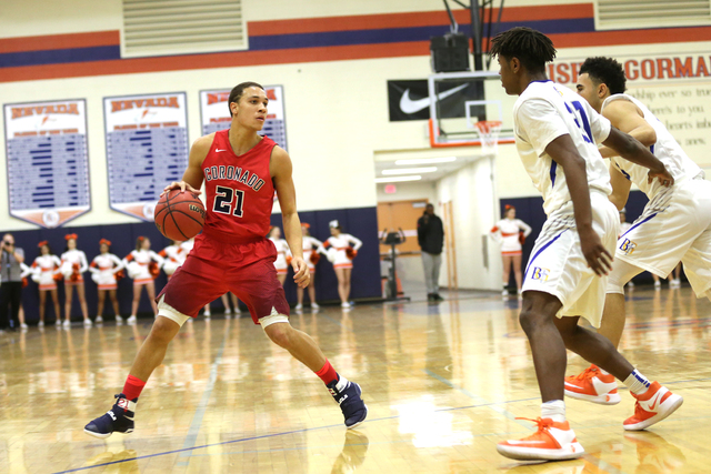 Coronado’s Freddy Reeves (21) gets ready to pass Bishop Gorman players during a basket ...