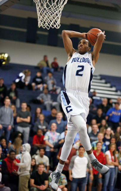 Centennial’s Troy Brown goes up for a dunk on Friday against Durango. Brown had 16 points ...