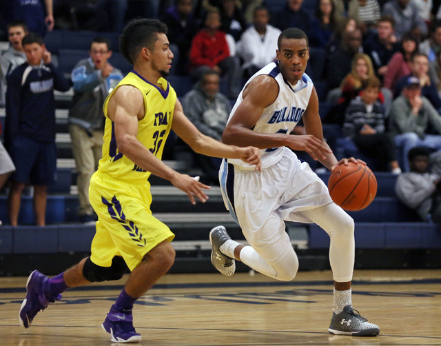 Centennial’s Troy Brown, right, drives the ball past Durango’s Victor Ross during a ...