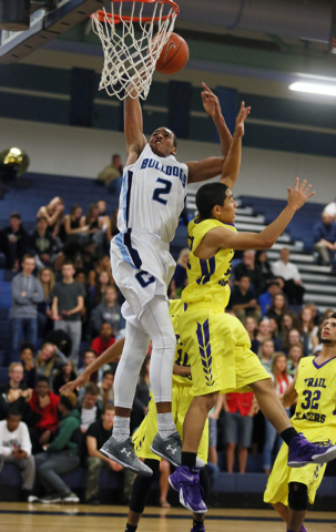 Centennial’s Troy Brown (2) goes up for a shot over Durango’s Apollo Corley on Frida ...