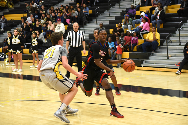 Valley’s Nick Brannon (23) drives by Clark’s Carter Olsen on Saturday. Brannon h ...