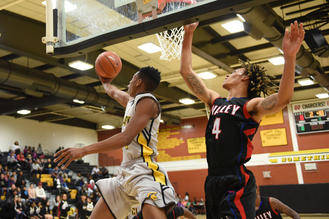 Clark’s Darius Jackson (44) goes up for a shot against Valley Taveon Jackson (4) on Sa ...