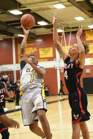 Clark’s Keyshawn Webb (1) goes up for a shot against Valley’s Taveon Jackson (4) ...