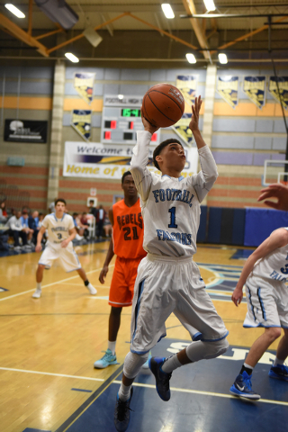 Foothill’s Kevin Woodland (1) goes up for a layup against National Prep Academy’ ...