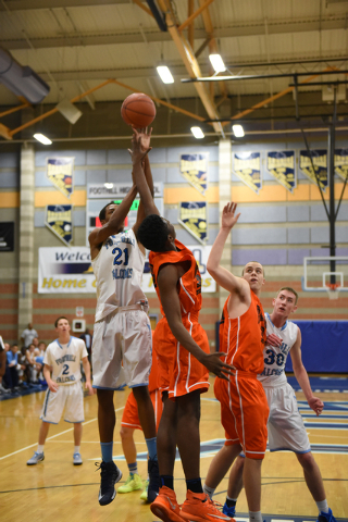 Foothill’s Torrance Littles (21) goes up for a shot against National Prep Academy̵ ...