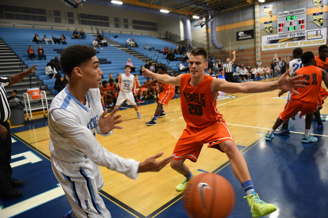 Foothill’s Kevin Woodland (1), left, passes the ball past National Prep Academy’ ...